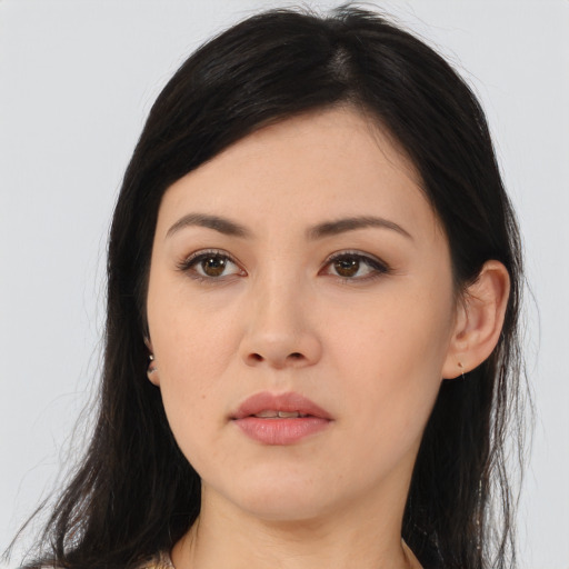 Joyful asian young-adult female with long  brown hair and brown eyes