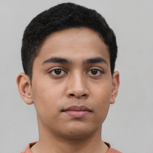 Neutral latino young-adult male with short  black hair and brown eyes