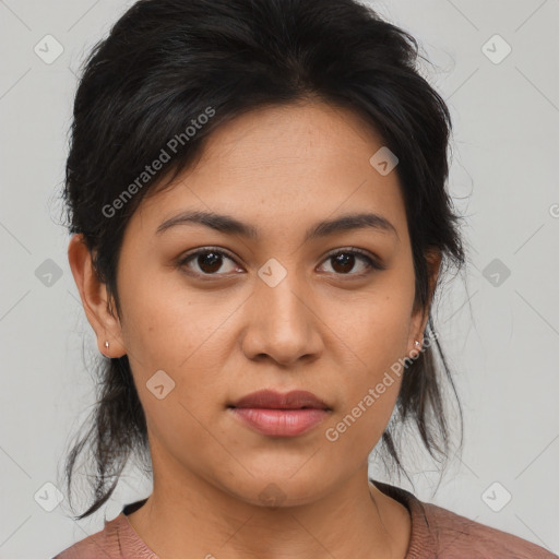 Joyful latino young-adult female with medium  brown hair and brown eyes