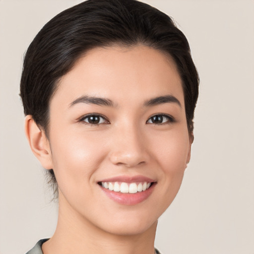 Joyful white young-adult female with short  brown hair and brown eyes