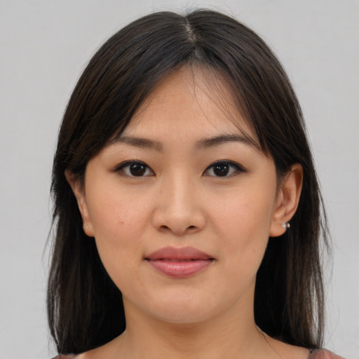 Joyful asian young-adult female with medium  brown hair and brown eyes
