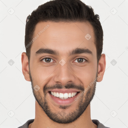 Joyful white young-adult male with short  black hair and brown eyes