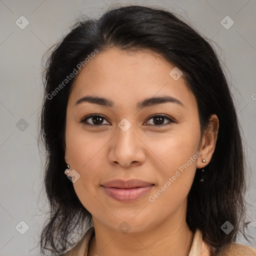 Joyful latino young-adult female with medium  brown hair and brown eyes