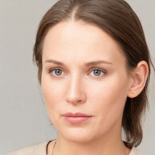 Neutral white young-adult female with long  brown hair and blue eyes