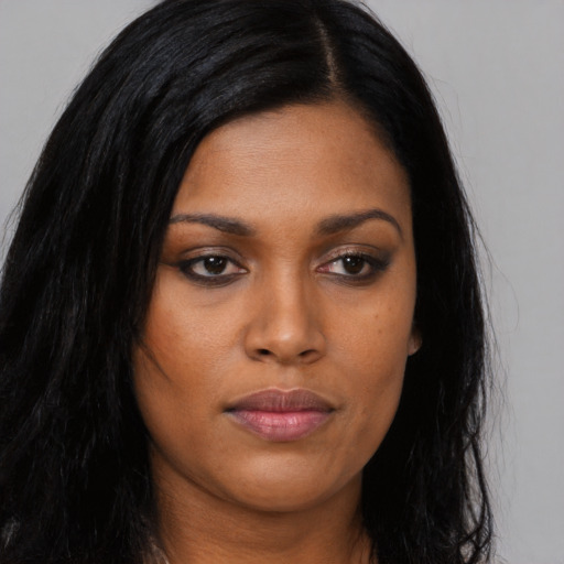 Joyful asian young-adult female with long  black hair and brown eyes