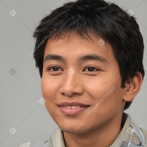 Joyful asian young-adult male with short  brown hair and brown eyes