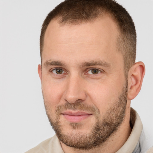 Joyful white adult male with short  brown hair and brown eyes