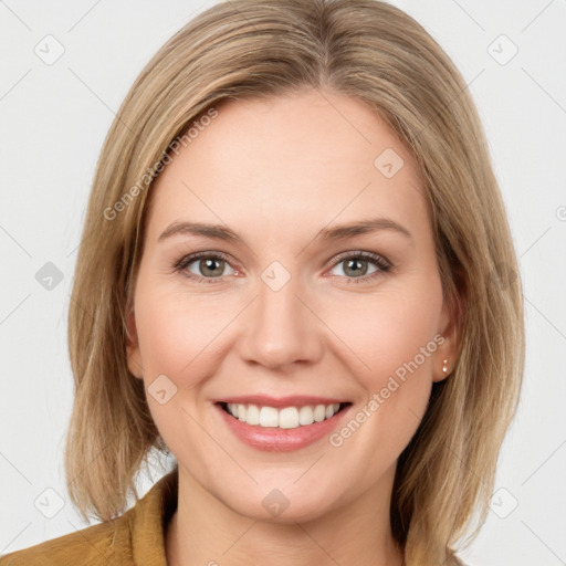 Joyful white young-adult female with medium  brown hair and blue eyes