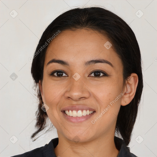 Joyful asian young-adult female with medium  black hair and brown eyes