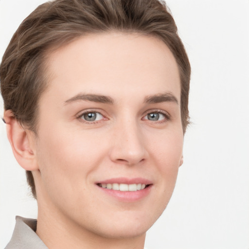 Joyful white young-adult female with short  brown hair and grey eyes