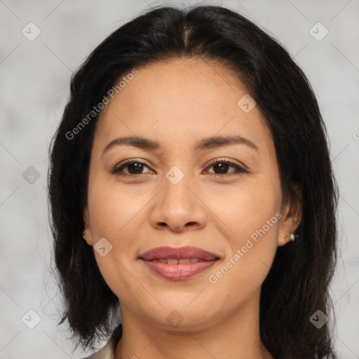 Joyful asian adult female with medium  brown hair and brown eyes