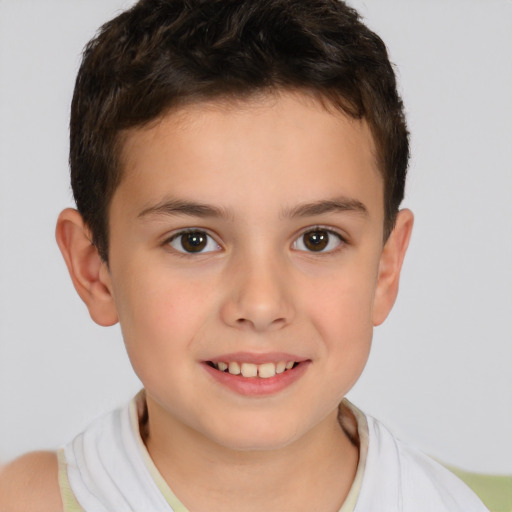 Joyful white child male with short  brown hair and brown eyes