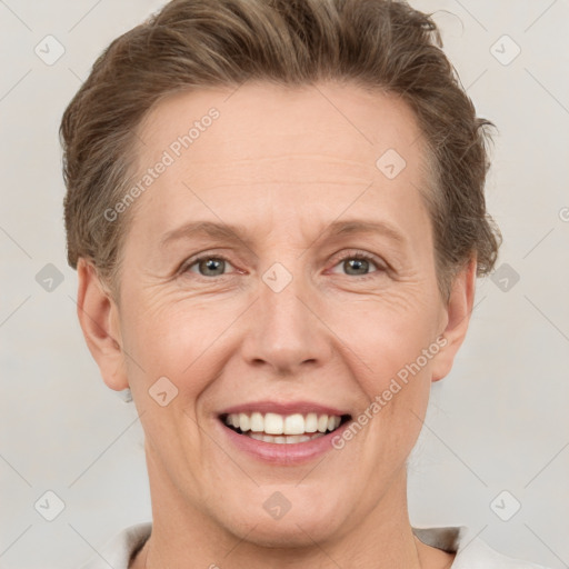 Joyful white adult female with short  brown hair and grey eyes