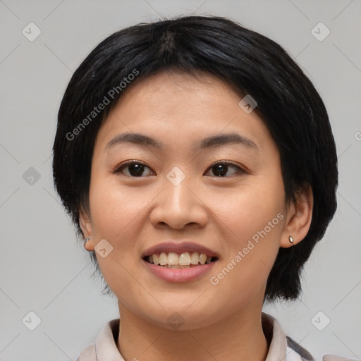 Joyful asian young-adult female with medium  black hair and brown eyes