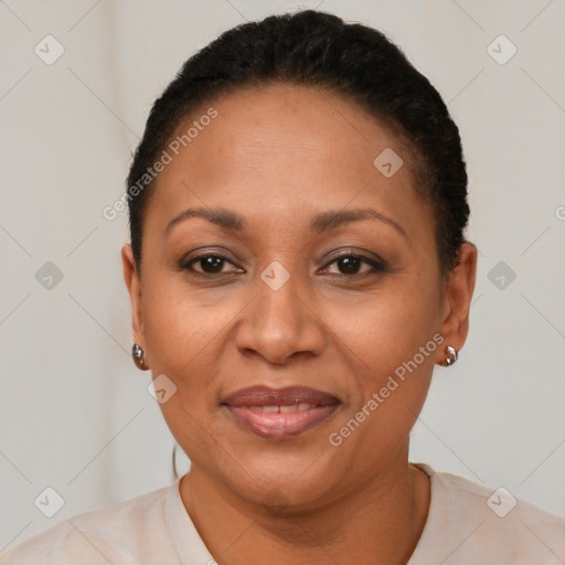 Joyful latino adult female with short  brown hair and brown eyes