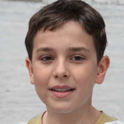 Joyful white child male with short  brown hair and brown eyes