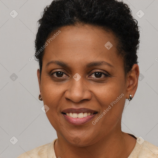 Joyful black young-adult female with short  brown hair and brown eyes