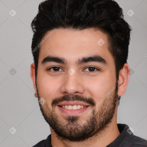 Joyful white young-adult male with short  black hair and brown eyes