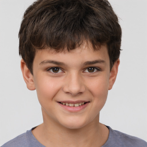 Joyful white child male with short  brown hair and brown eyes