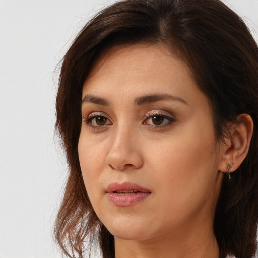 Neutral white young-adult female with long  brown hair and brown eyes