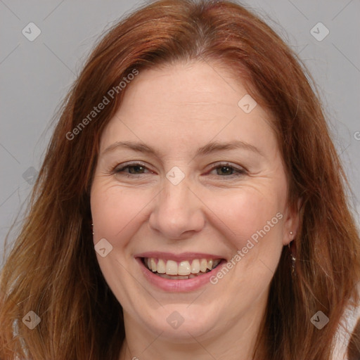 Joyful white adult female with long  brown hair and brown eyes