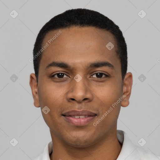 Joyful black young-adult male with short  black hair and brown eyes