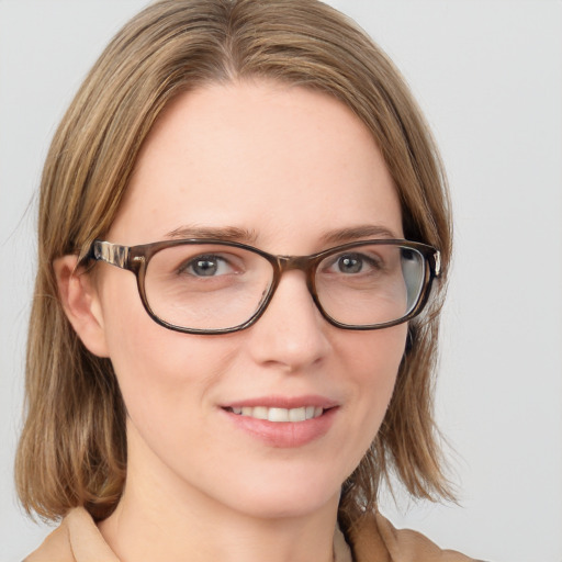 Joyful white young-adult female with medium  brown hair and blue eyes