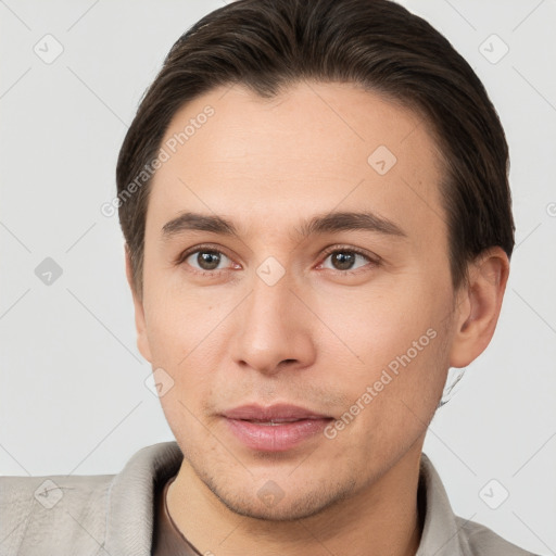 Joyful white young-adult male with short  brown hair and brown eyes