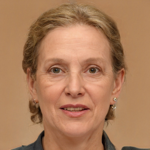 Joyful white middle-aged female with medium  brown hair and brown eyes