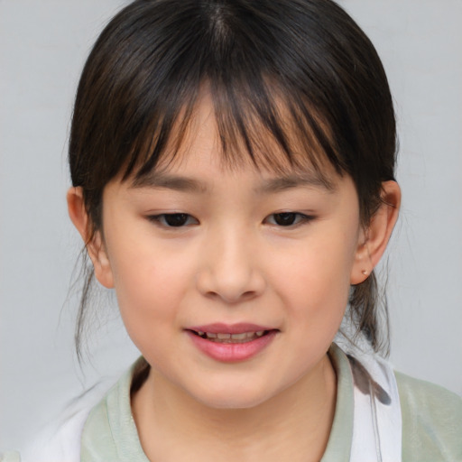 Joyful asian child female with medium  brown hair and brown eyes