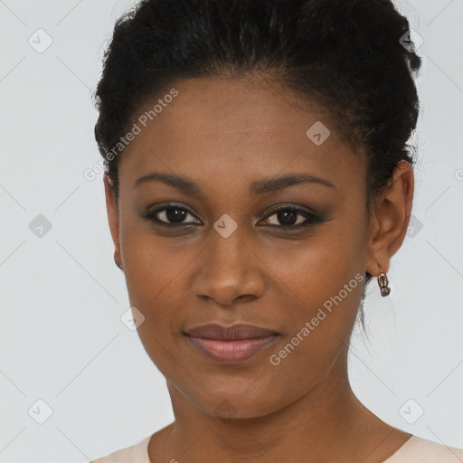 Joyful black young-adult female with short  brown hair and brown eyes