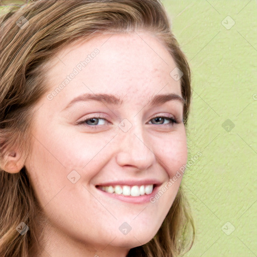 Joyful white young-adult female with long  brown hair and blue eyes