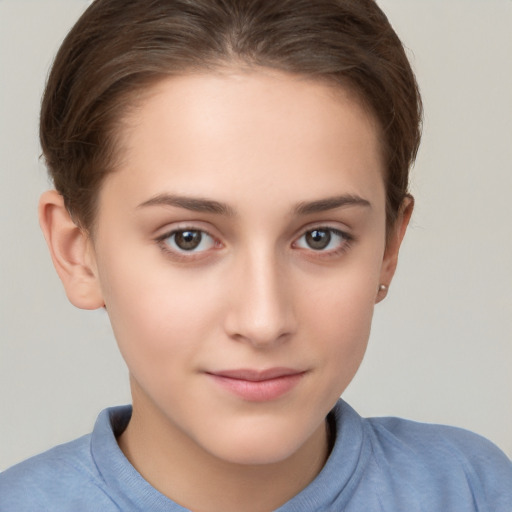 Joyful white child female with short  brown hair and brown eyes