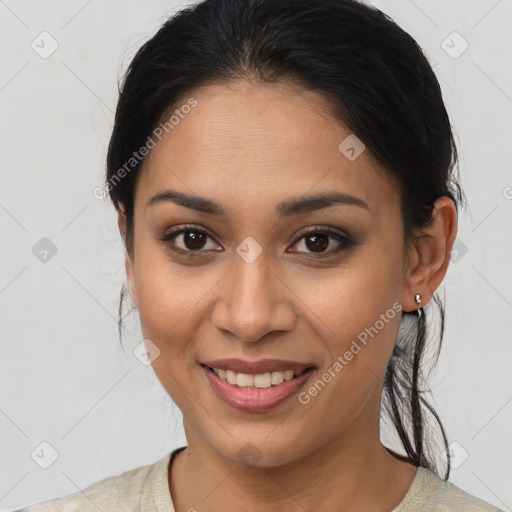 Joyful asian young-adult female with medium  brown hair and brown eyes