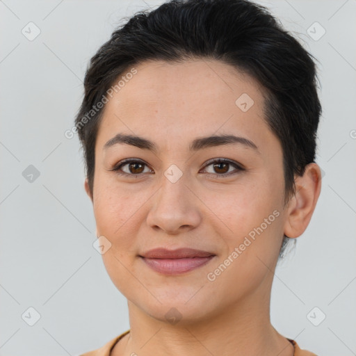 Joyful latino young-adult female with short  brown hair and brown eyes