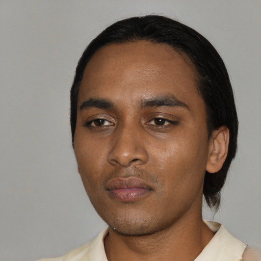 Neutral black young-adult male with medium  black hair and brown eyes