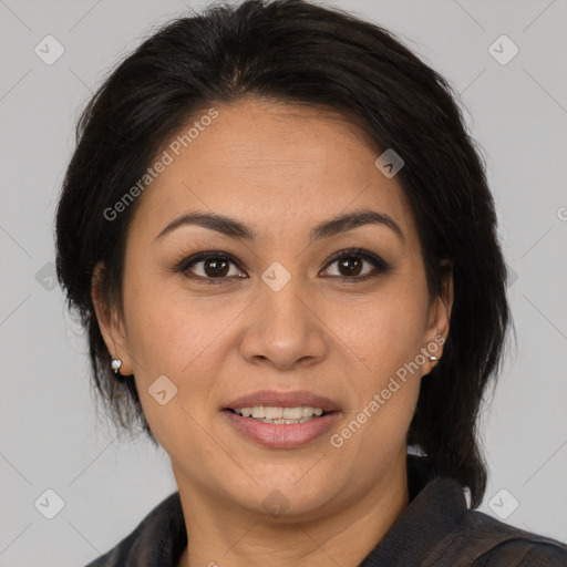 Joyful asian adult female with medium  brown hair and brown eyes