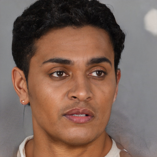 Neutral black young-adult male with short  brown hair and brown eyes