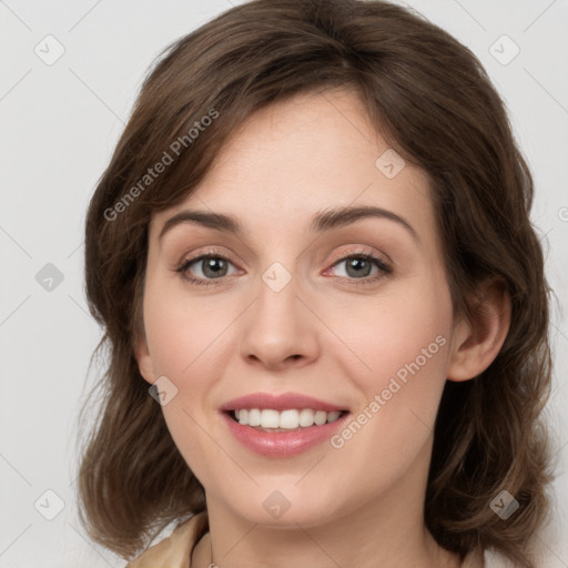 Joyful white young-adult female with medium  brown hair and grey eyes