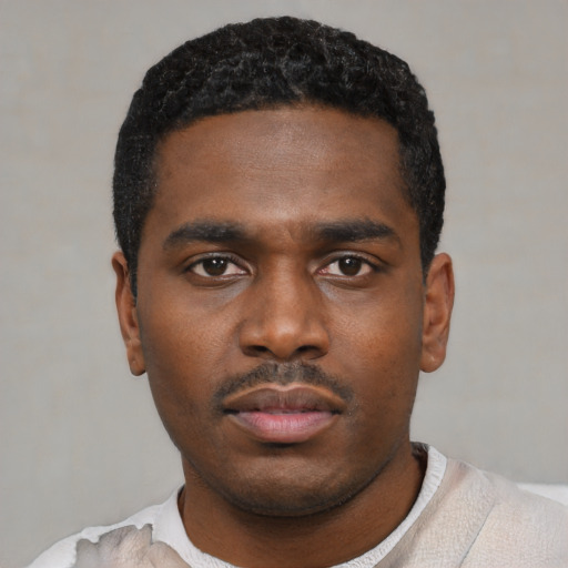 Neutral black young-adult male with short  black hair and brown eyes
