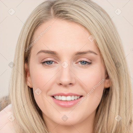 Joyful white young-adult female with long  brown hair and blue eyes