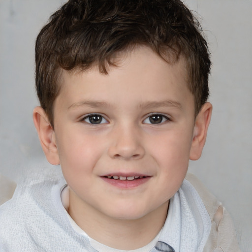 Joyful white child male with short  brown hair and brown eyes