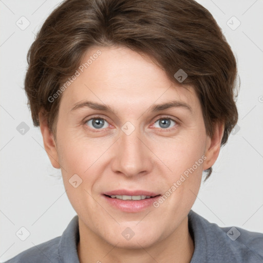 Joyful white adult female with short  brown hair and grey eyes