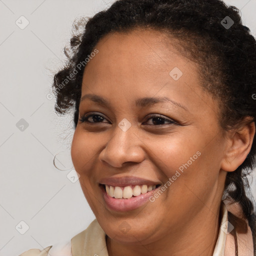 Joyful black young-adult female with medium  brown hair and brown eyes