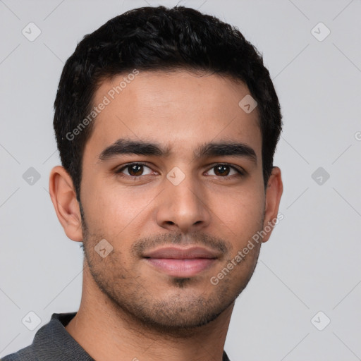 Joyful latino young-adult male with short  brown hair and brown eyes