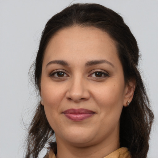 Joyful white young-adult female with medium  brown hair and brown eyes