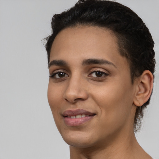 Joyful latino young-adult female with short  black hair and brown eyes
