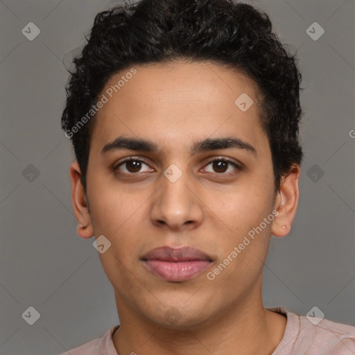 Joyful latino young-adult male with short  brown hair and brown eyes