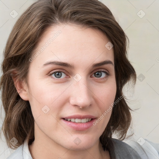 Joyful white young-adult female with medium  brown hair and blue eyes