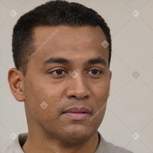 Neutral latino young-adult male with short  black hair and brown eyes